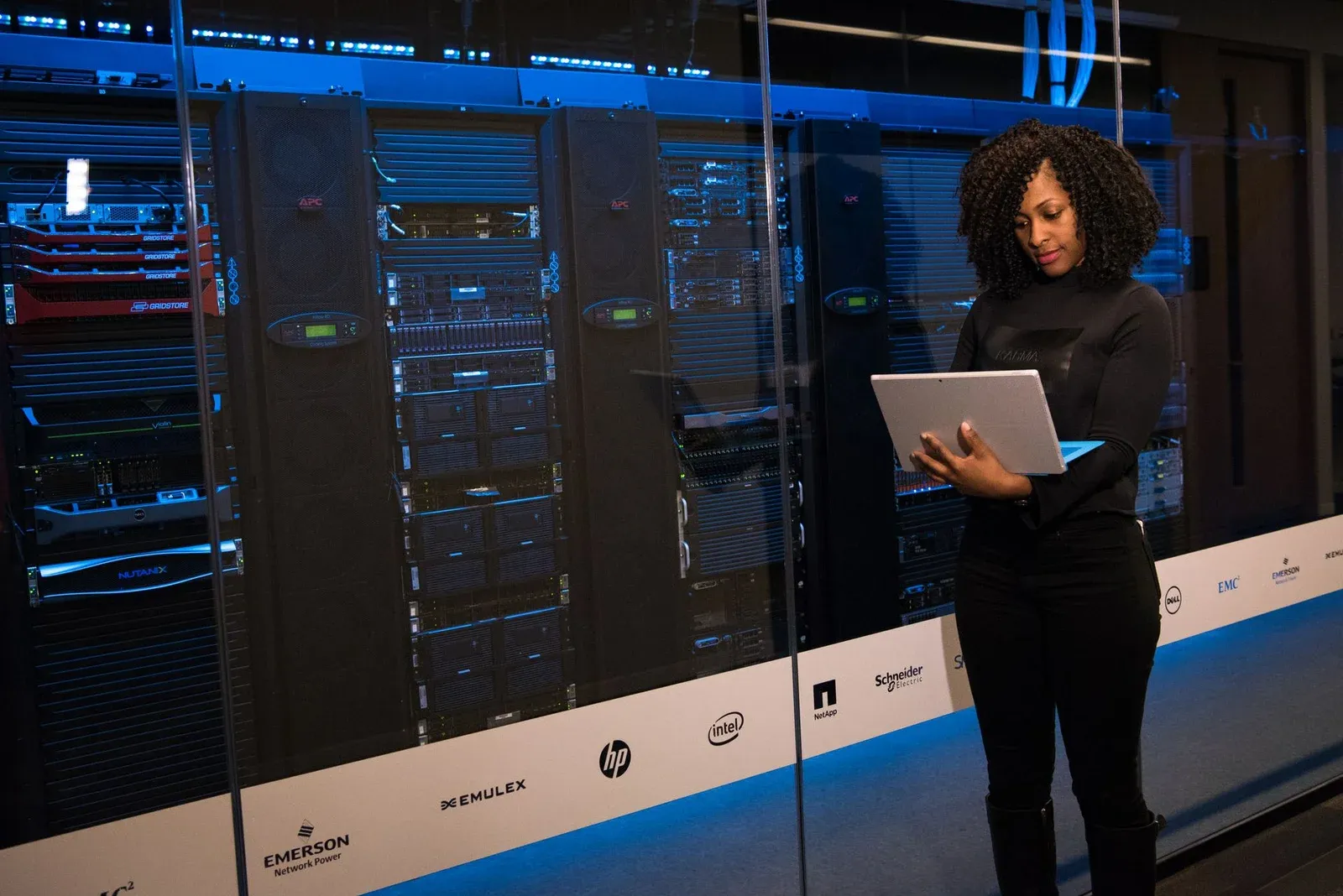 Engineer with a laptop in a data centre