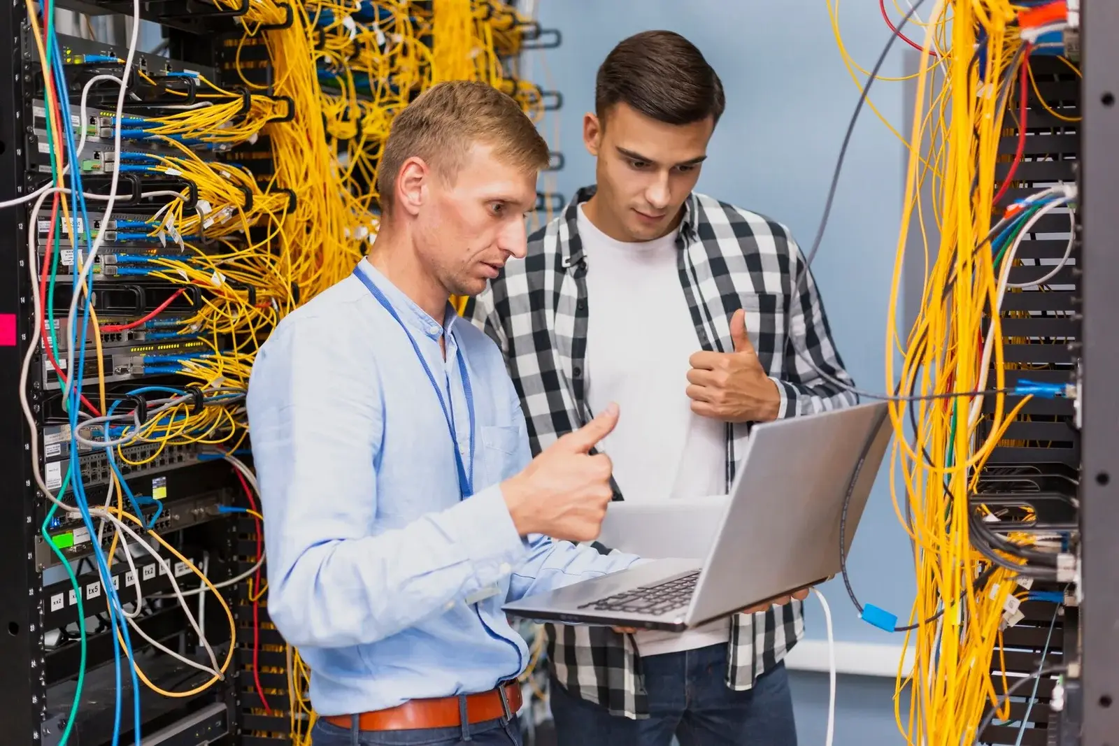 Two engineers reviewing a fibre install